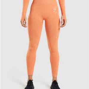 Never worn Gymshark Women's Orange Leggings size S